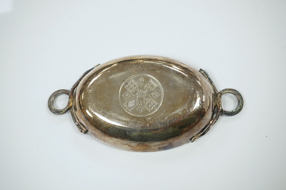 A 1970's Brittania standard silver commemorative small dish, C. Hoare & Co, London, 1972, 92mm, together with a German 925 oval dish with serpent handles and inset with coin, gross 8.9oz. Condition - fair